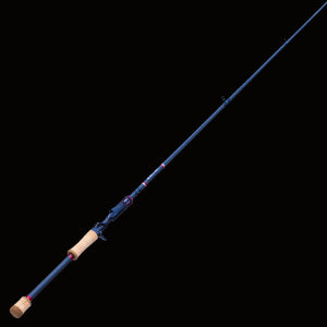 The Keeper Rods-Doozie Doozie 7'0" Medium Heavy-Fast Versatile All-Around Bass Rod features a blue finish, cork handle, and trigger grip—tapering to a fine tip with line guides—ideal for precision freshwater casting. Set against a solid black background.