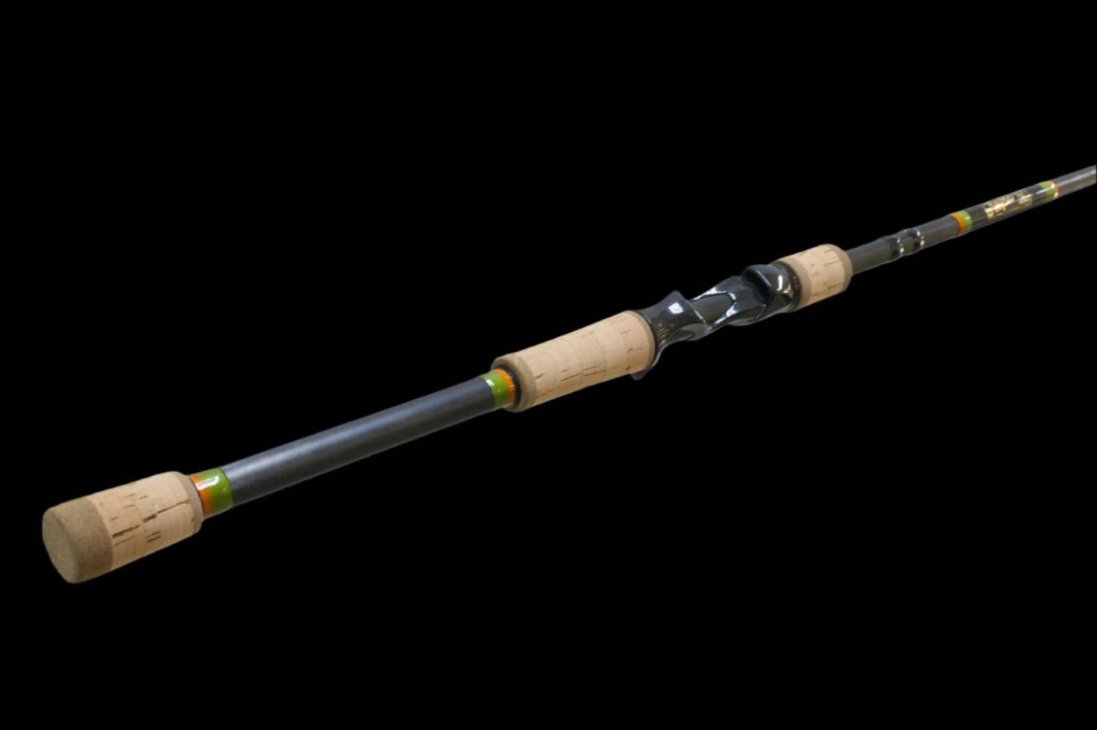 A fishing rod with cork handles and a black reel seat, displayed on a black background.