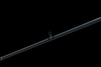 The Doozie Series 72 MH X-Ray Precision Power Heavy Cover Rod by Keeper Rods-Doozie is a black fishing rod with red accents and a cork handle, highlighted against a black background. Its sleek design features multiple eyelets, making it perfect for bass fishing enthusiasts.