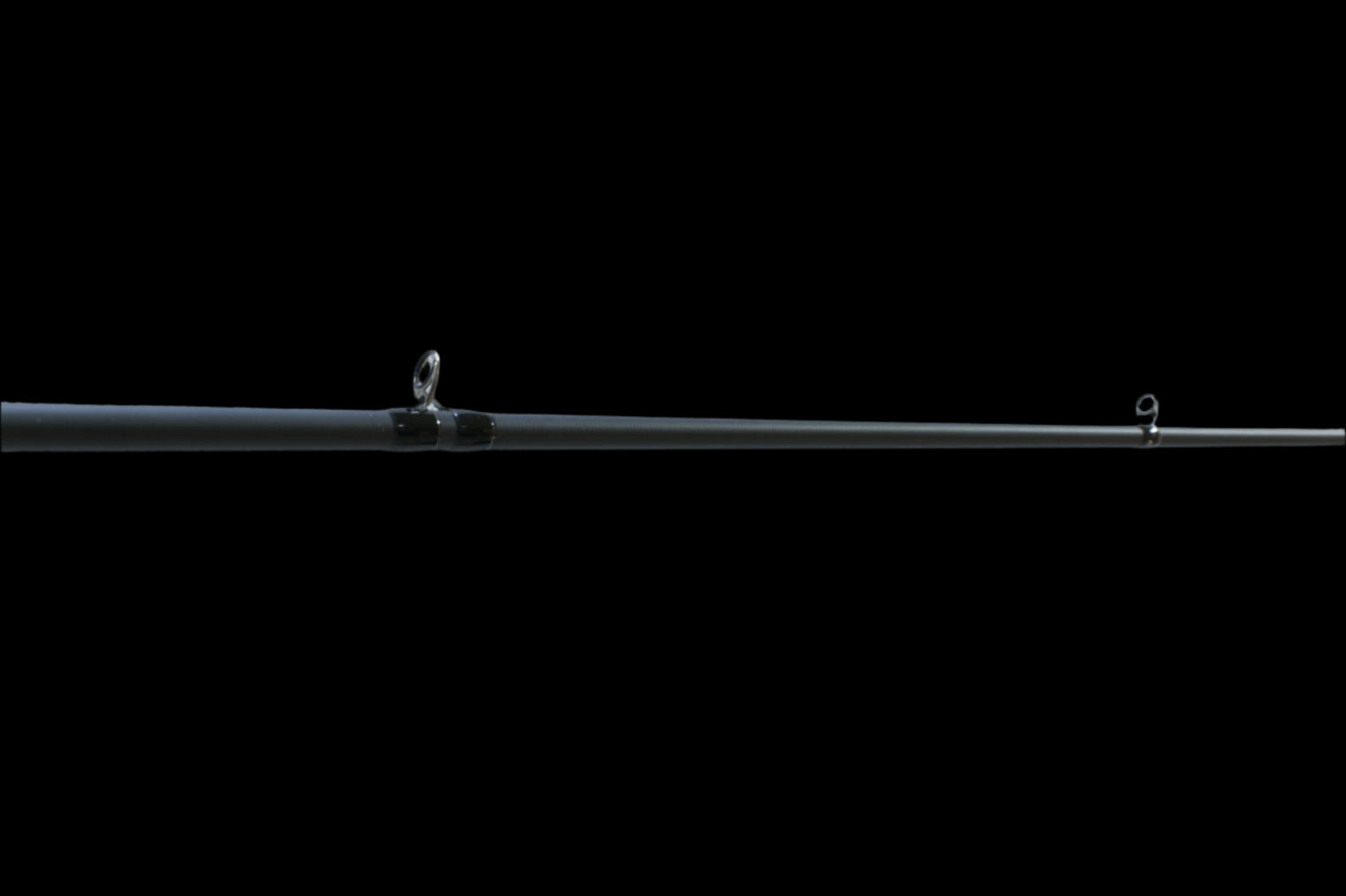 The Doozie Series 73 H+ Frog & Jig Power Casting Rod by Keeper Rods-Doozie is a black rod with a cork handle and red accents. It features an NFC IM intermediate modulus blank for enhanced performance and is displayed on a solid black background, angled from bottom left to top right.