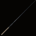 The Keeper Rods-Doozie Doozie 7'6" Pitching/C-Rig Heavy Mod-Fast Precision Casting Rod, featuring a cork handle and black reel seat, lies diagonally on a light surface with wooden planks in the corner.